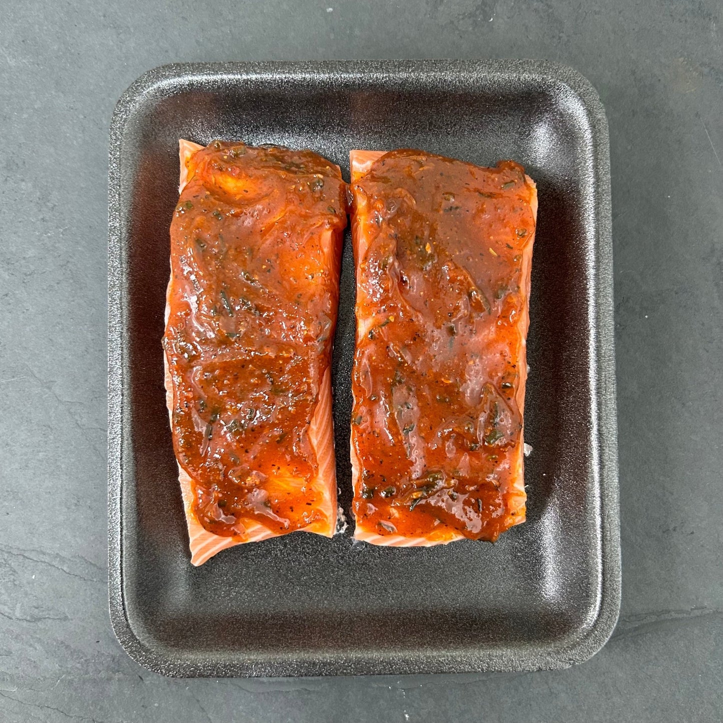 Flavoured Salmon Portions on a slate background, from Hamiltons Fish