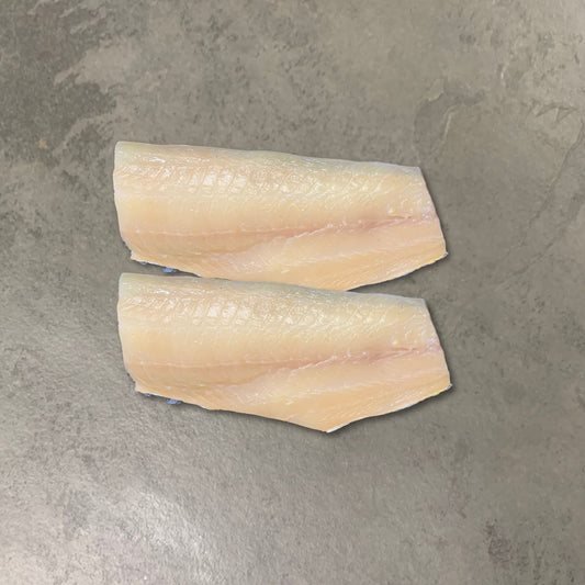 Natural Smoked Haddock Fillets on a slate background, from Hamiltons Fish