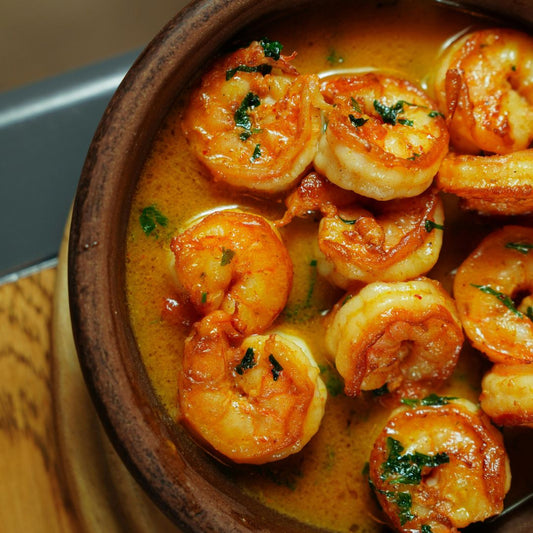 Raw Peeled King Prawns on a slate background, from Hamiltons Fish