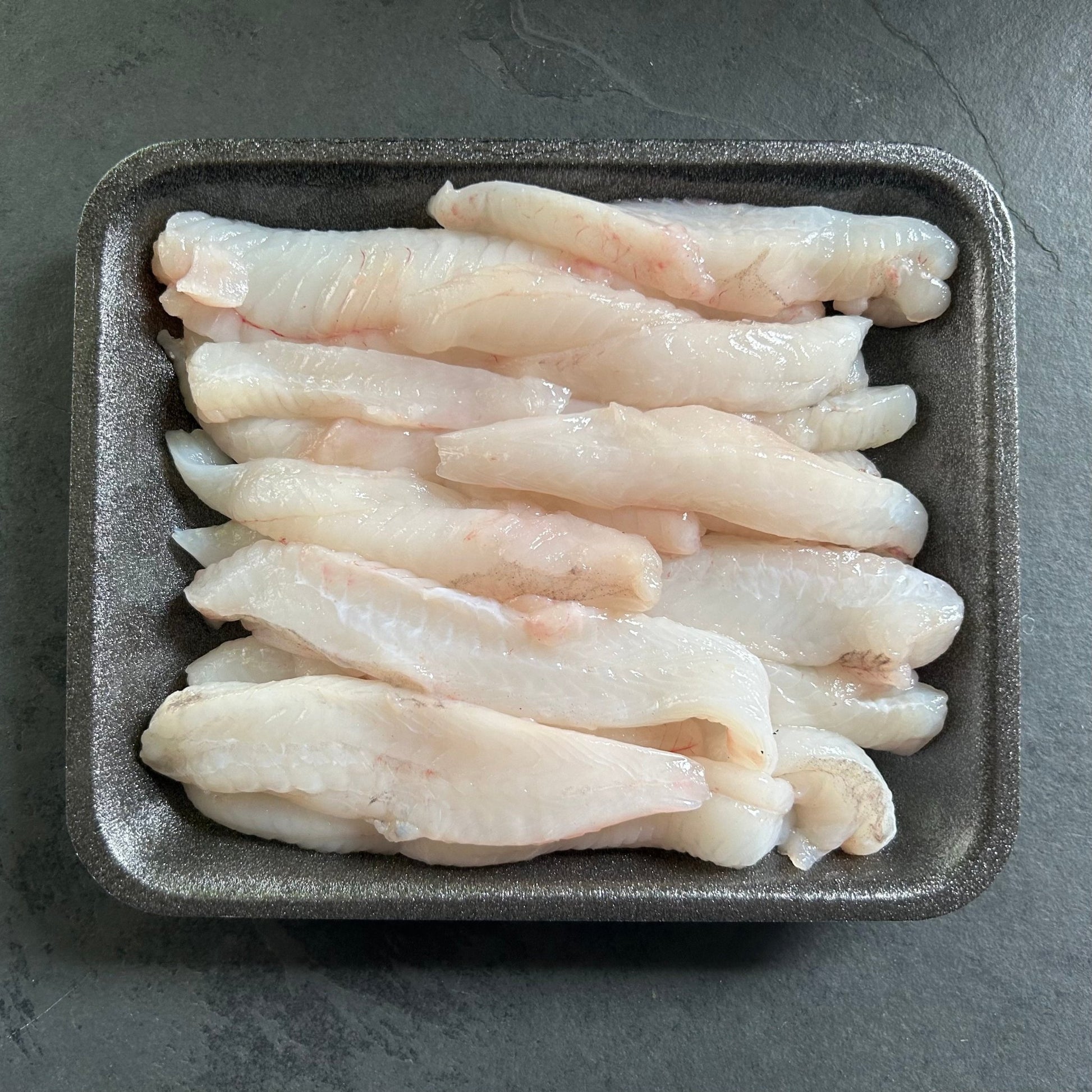 Wild Monkfish Goujons on a slate background, from Hamiltons Fish