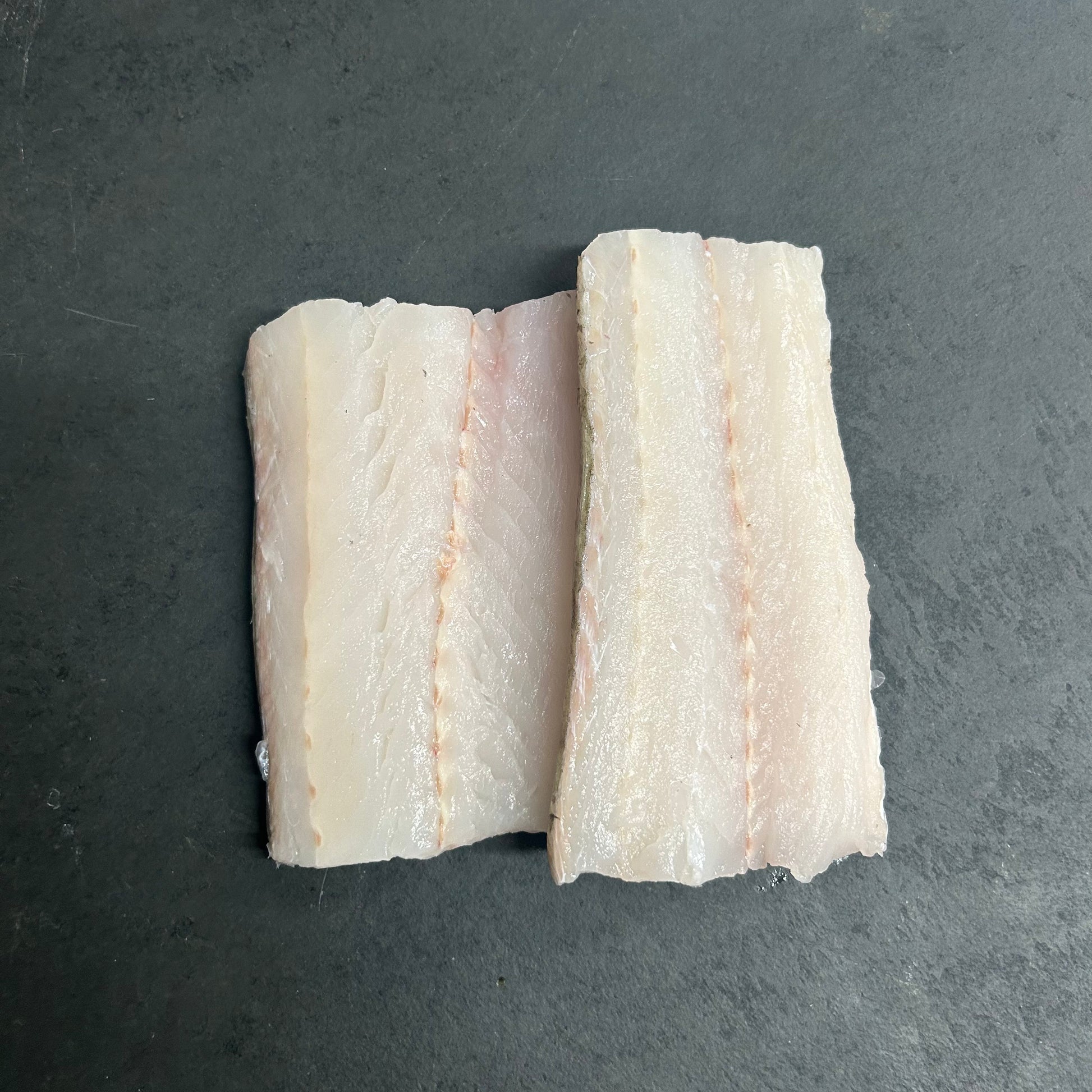 Wild Hake Fillets on a slate background, from Hamiltons Fish