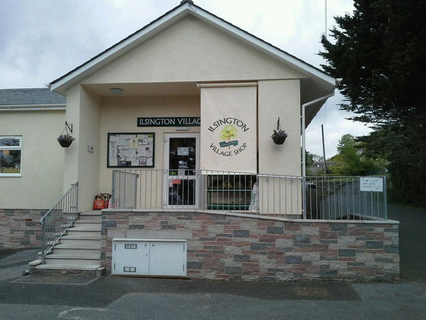 Ilswington Village Hall with a sign above the entrance.