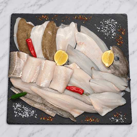 Brixham Fillet Box – 20 Fresh Portions on a slate background, from Hamiltons Fish
