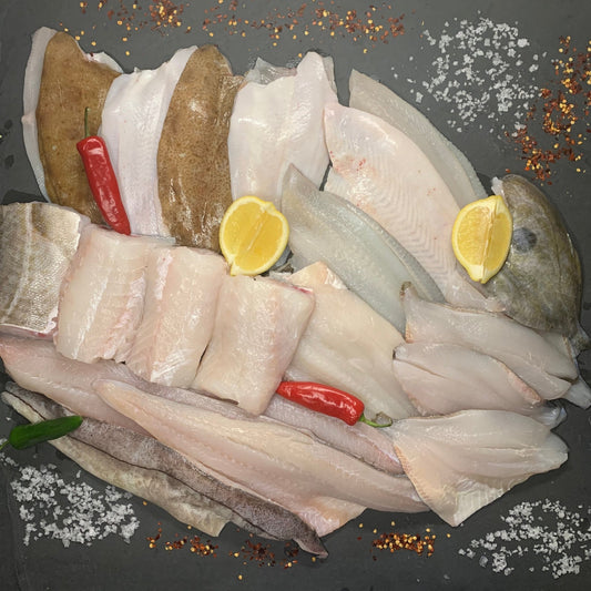 Brixham Fillet Box – 20 Fresh Portions on a slate background, from Hamiltons Fish