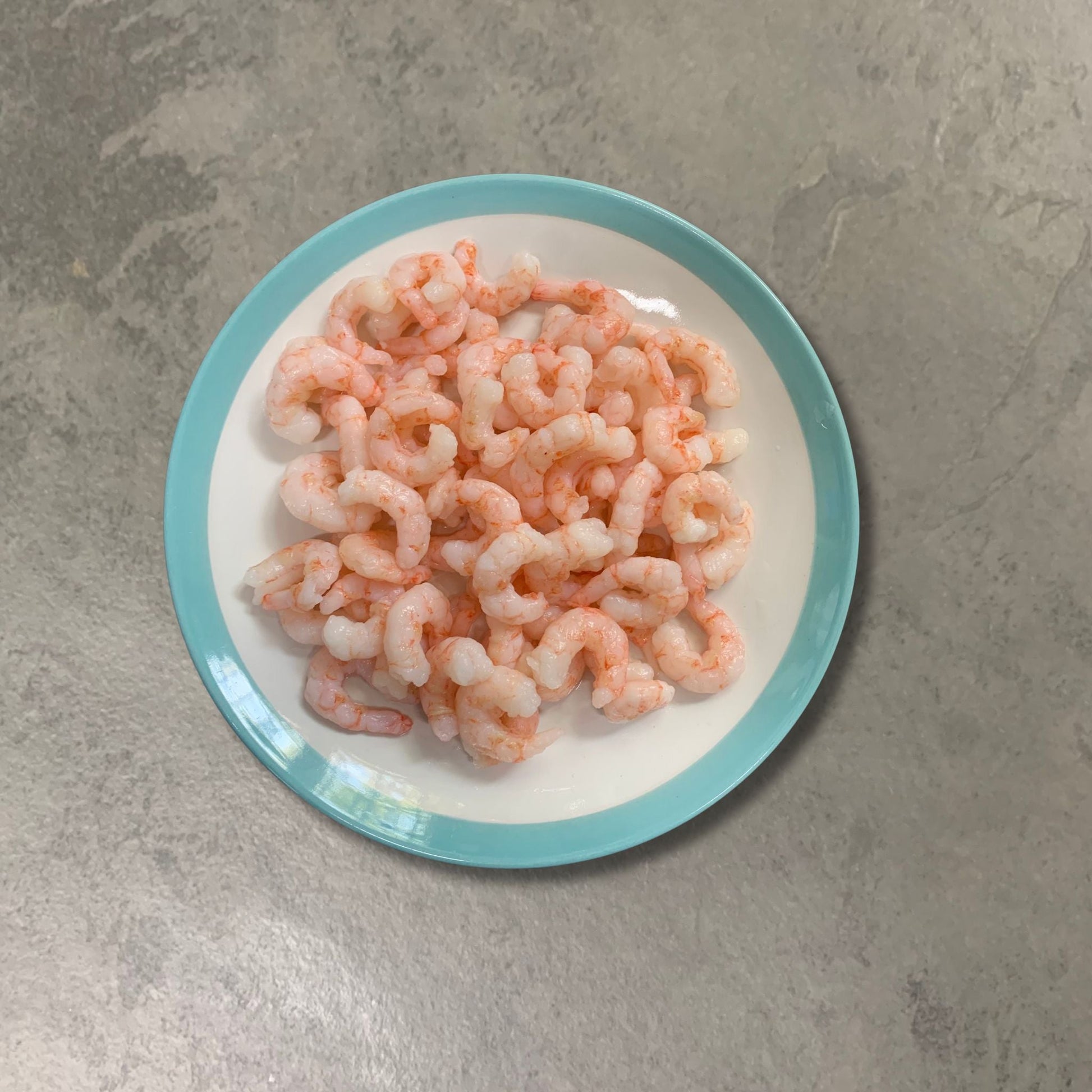 Cooked Peeled Prawns on a slate background, from Hamiltons Fish