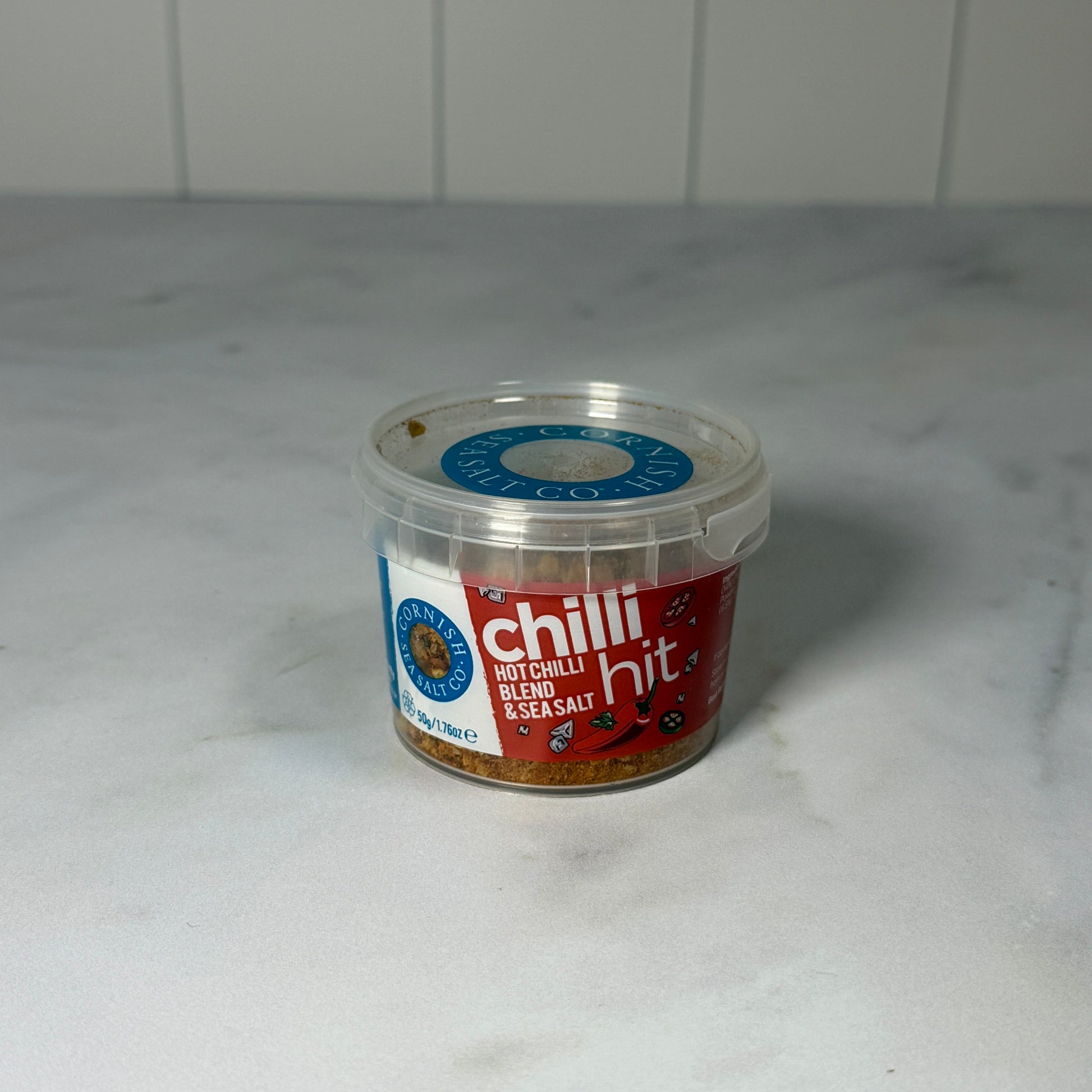 Cornish Sea Salt Chilli Hit Salt (50g) on a slate background, from Hamiltons Fish