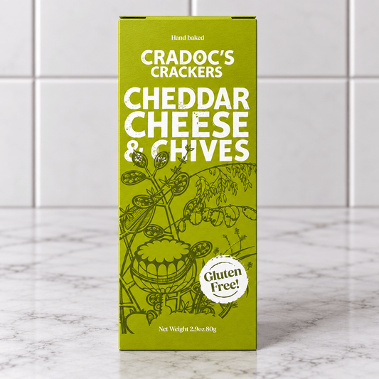 Cradoc’s Gluten Free Cheddar & Chives Crackers (80g) on a slate background, from Hamiltons Fish