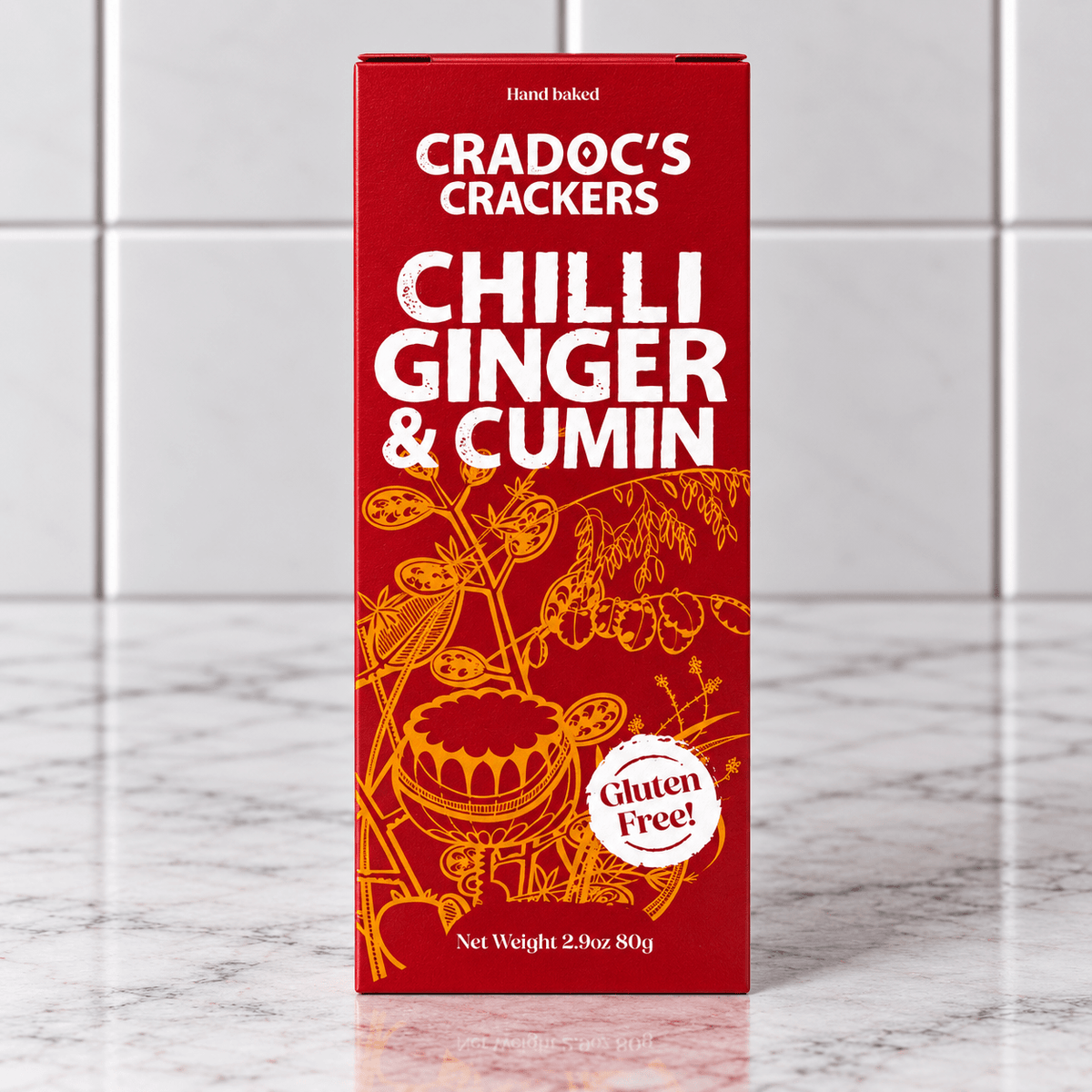 Cradoc’s Gluten Free Chilli, Ginger & Cumin Crackers (80g) on a slate background, from Hamiltons Fish