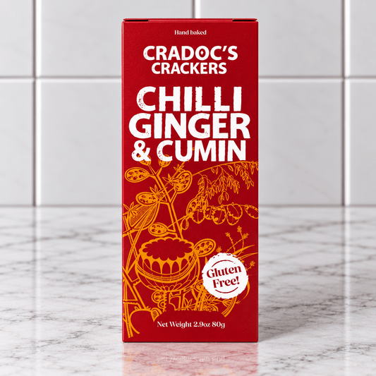 Cradoc’s Gluten Free Chilli, Ginger & Cumin Crackers (80g) on a slate background, from Hamiltons Fish