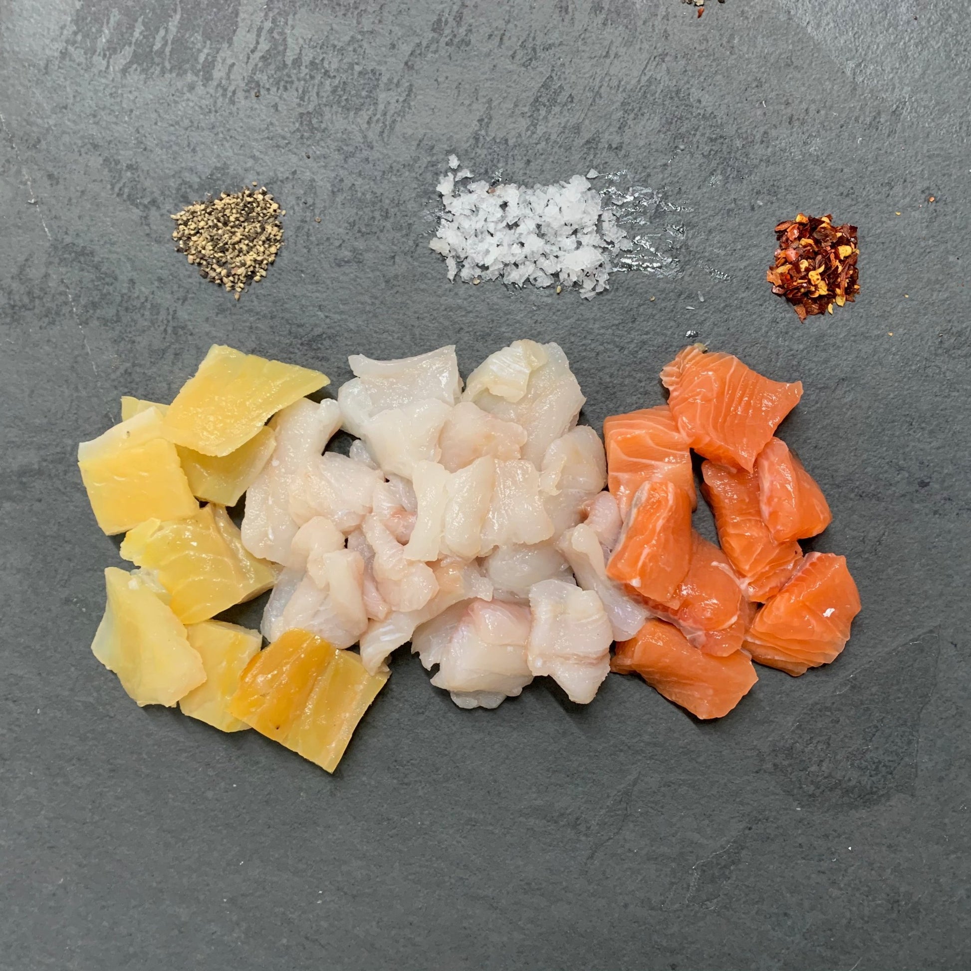 Finest Fish Pie Mix on a slate background, from Hamiltons Fish