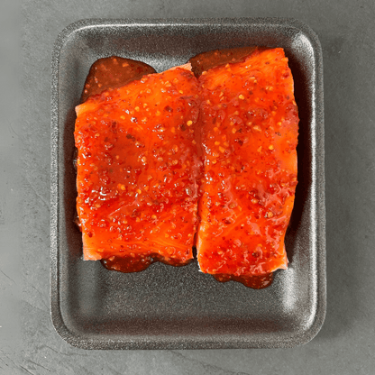 Flavoured Salmon Portions on a slate background, from Hamiltons Fish