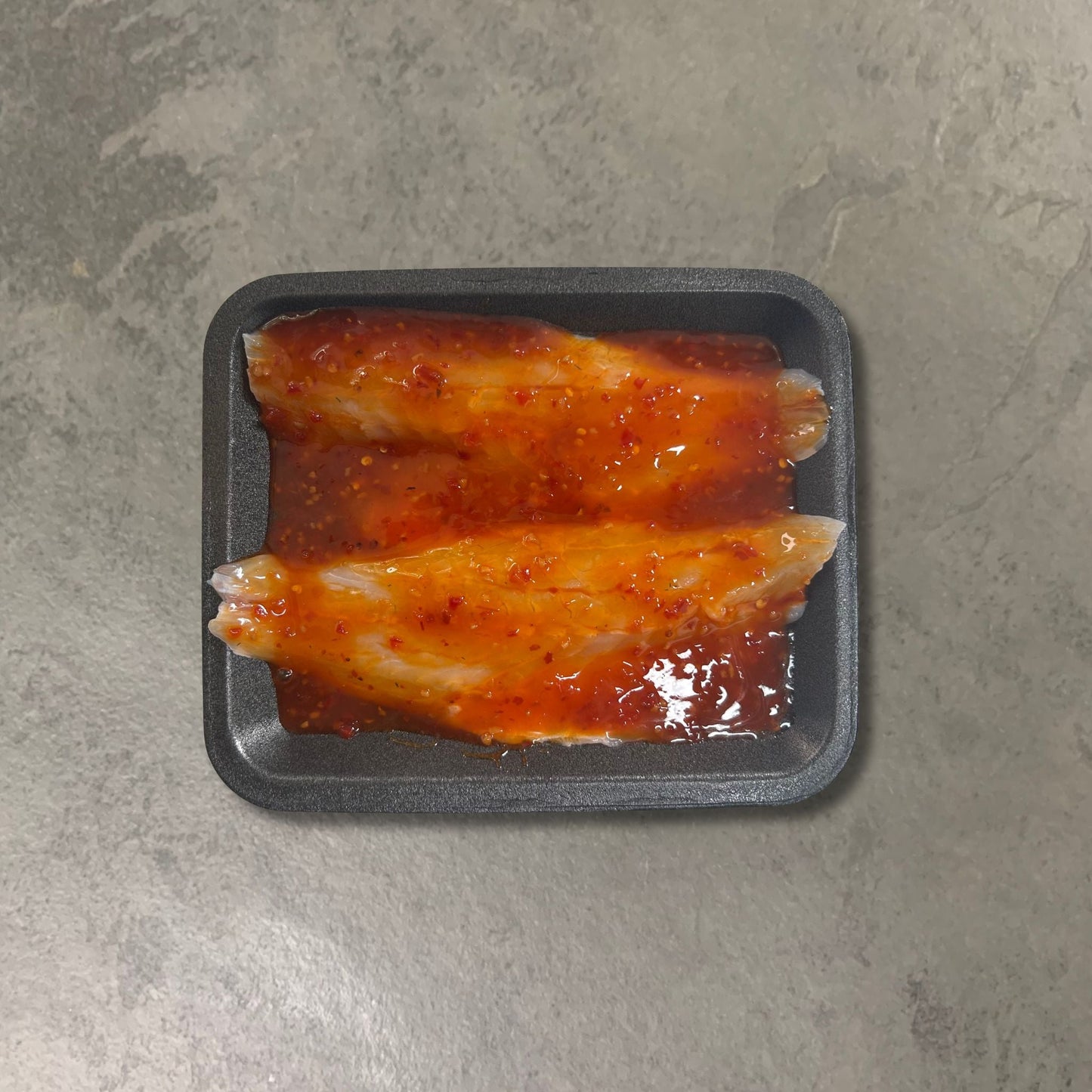 Flavoured Seabass Fillets on a slate background, from Hamiltons Fish