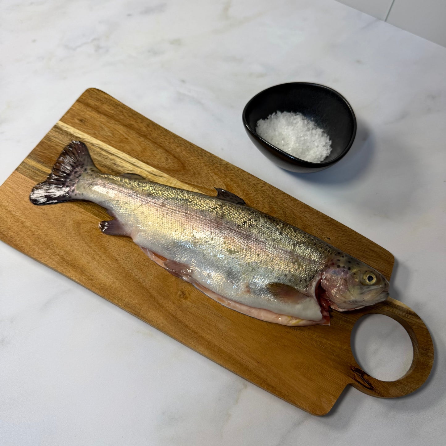 Fresh Farmed Rainbow Trout on a slate background, from Hamiltons Fish