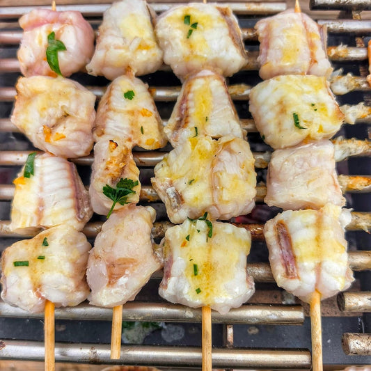 Fresh Monkfish Kebab Skewers on a slate background, from Hamiltons Fish