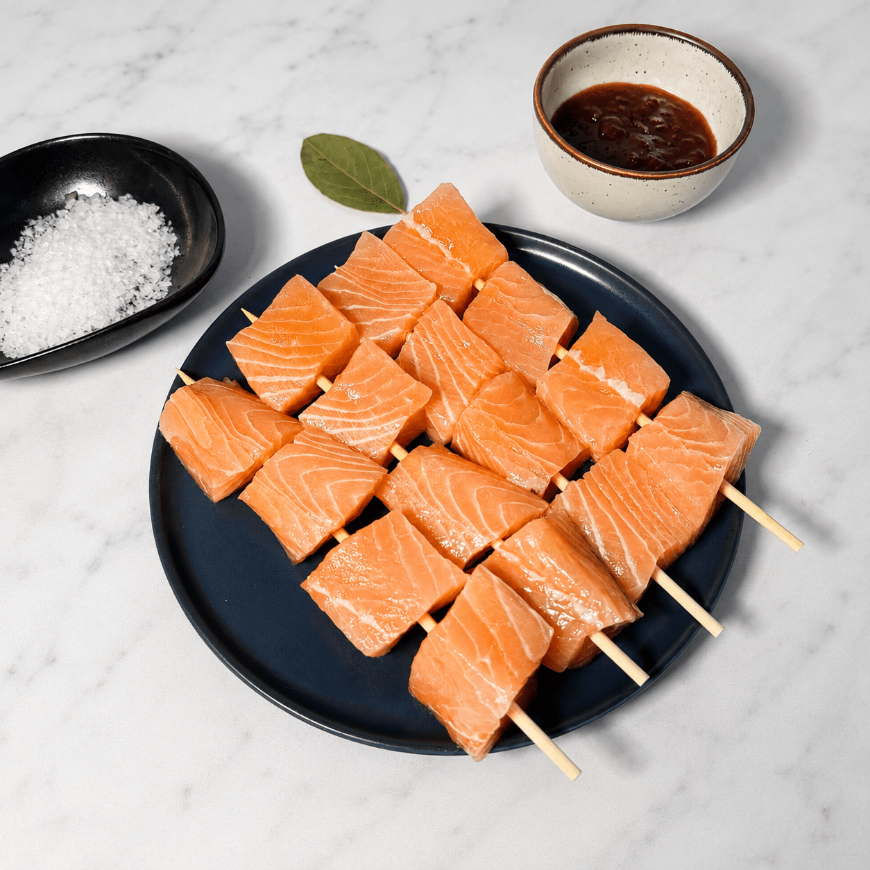 Fresh Salmon Kebab Skewers on a slate background, from Hamiltons Fish