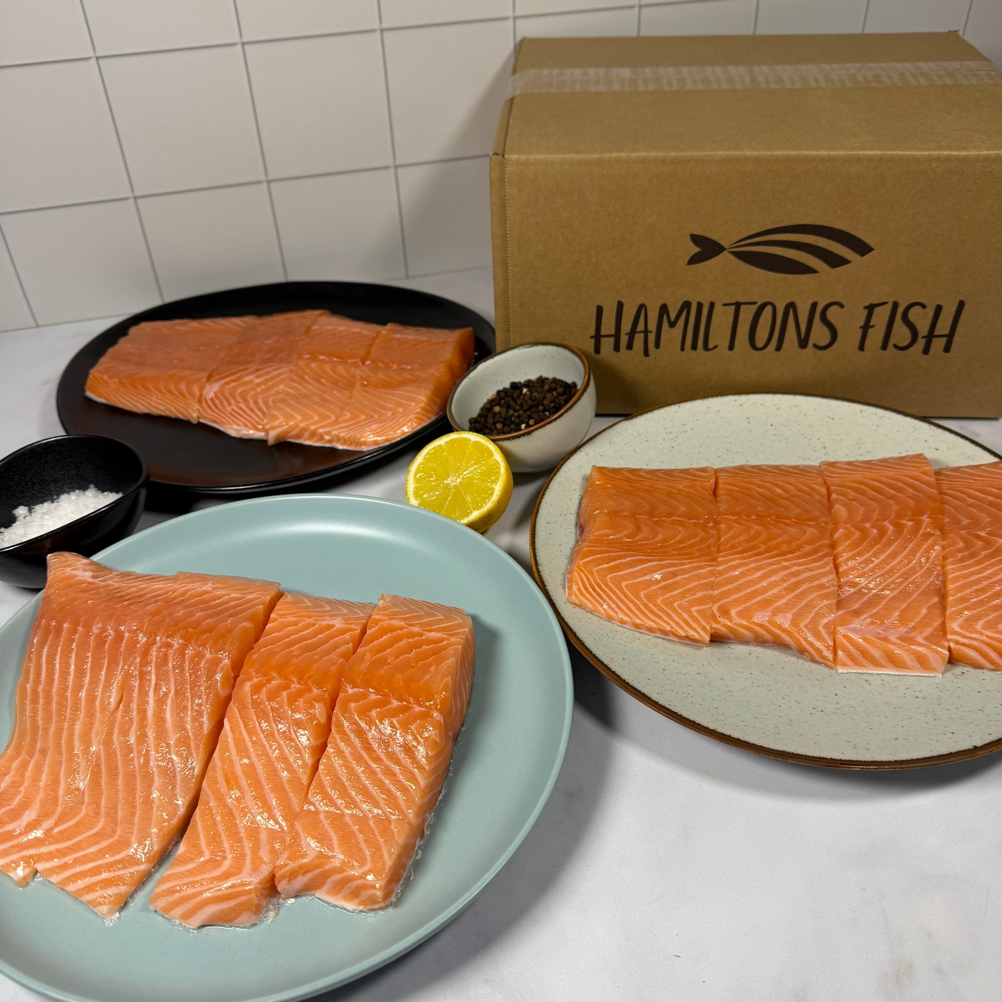 Fresh Salmon Portion Box on a slate background, from Hamiltons Fish