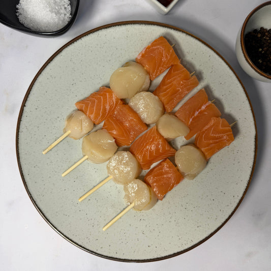 Fresh Scallop & Salmon Kebab Skewers on a slate background, from Hamiltons Fish