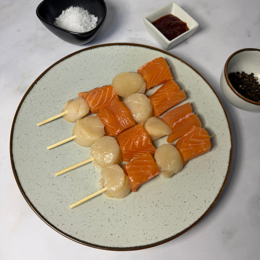Fresh Scallop & Salmon Kebab Skewers on a slate background, from Hamiltons Fish