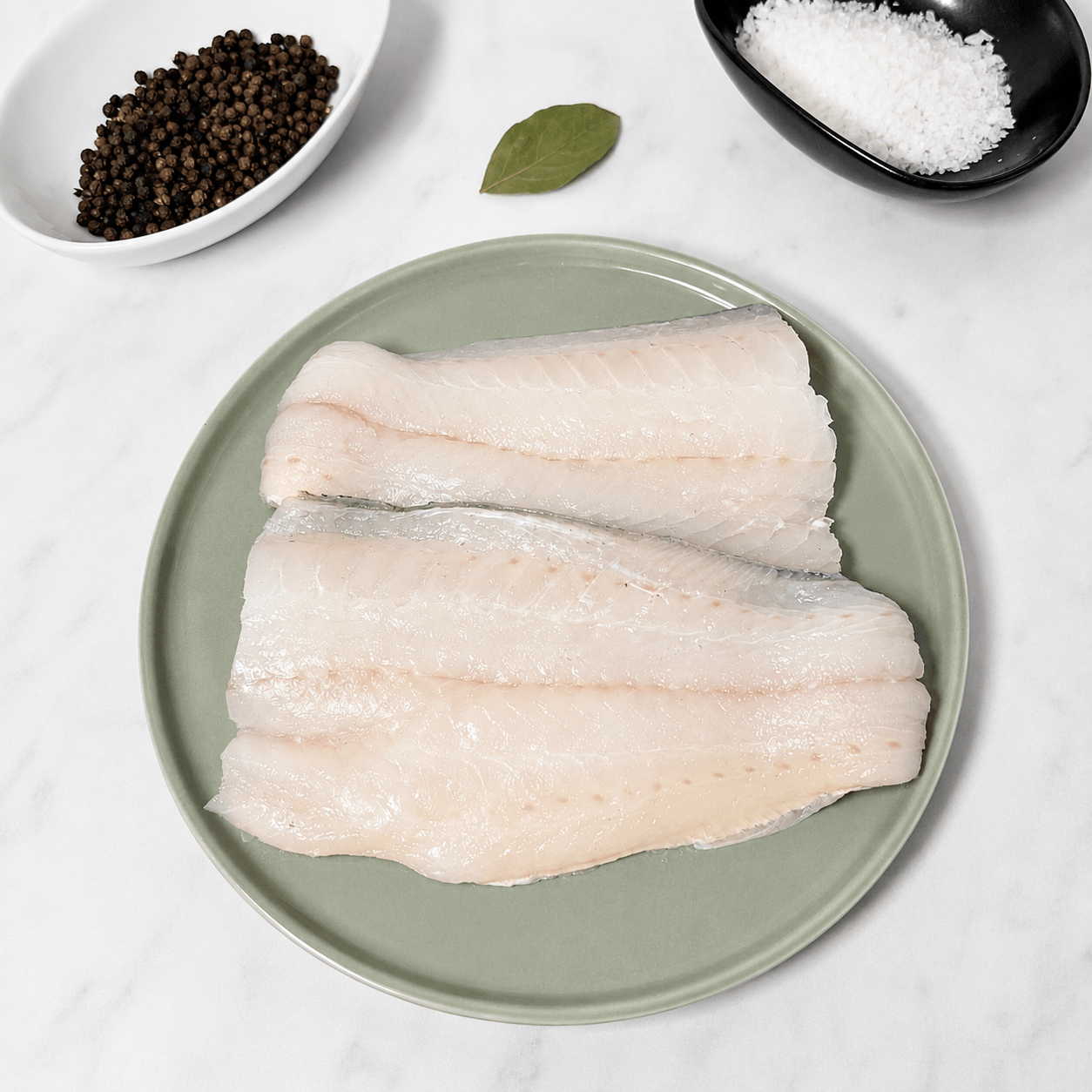 Fresh Wild Haddock Fillets on a slate background, from Hamiltons Fish