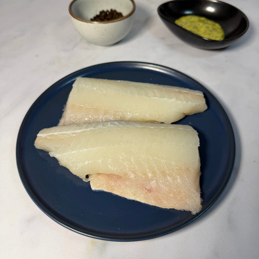 Fresh Wild Haddock Fillets on a slate background, from Hamiltons Fish