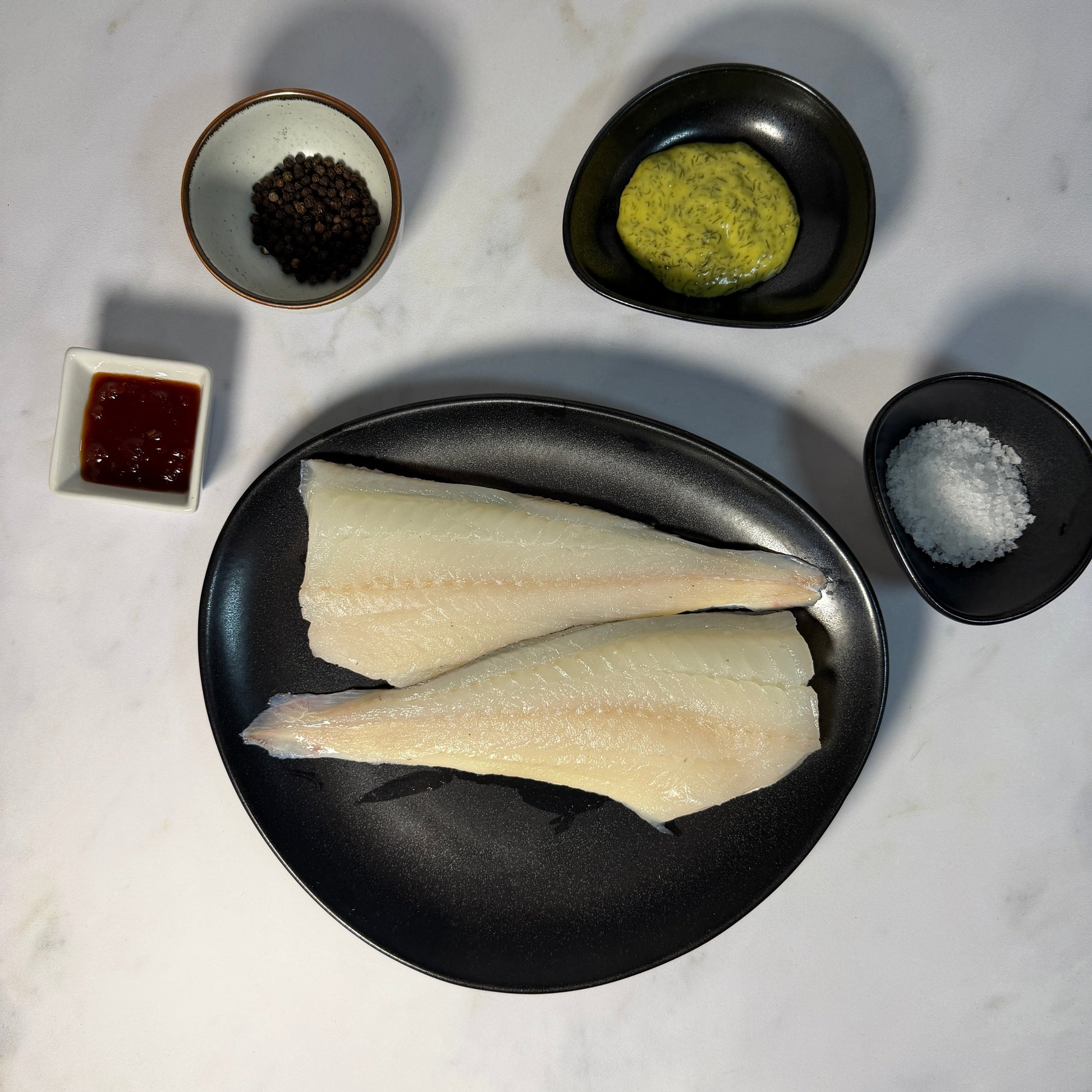Fresh Wild Haddock Fillets on a slate background, from Hamiltons Fish