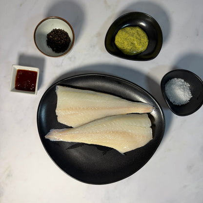 Fresh Wild Haddock Fillets on a slate background, from Hamiltons Fish
