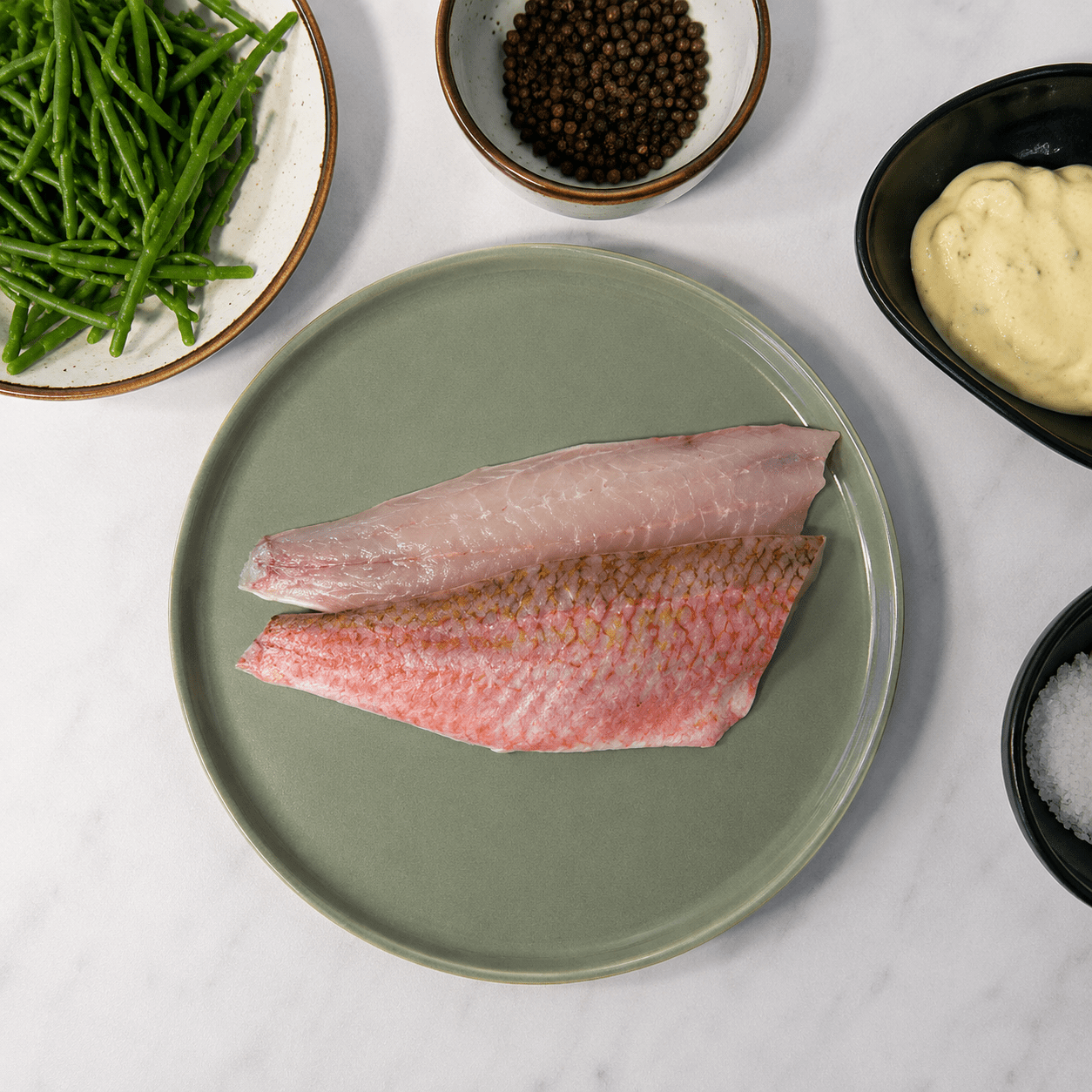 Fresh Wild Red Mullet Fillets on a slate background, from Hamiltons Fish
