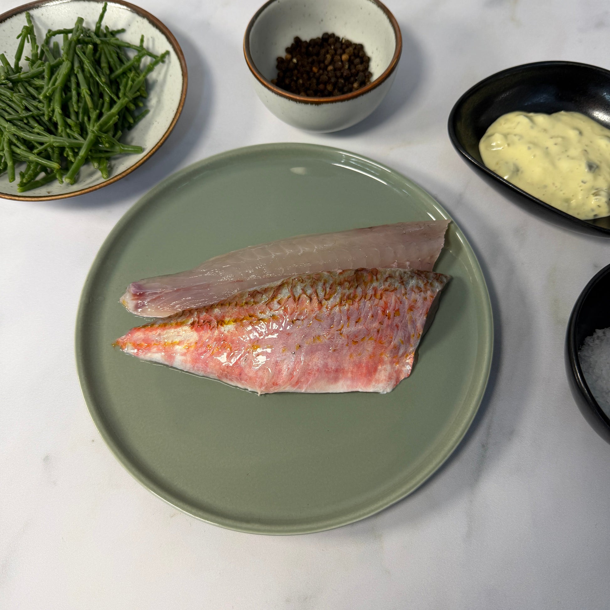 Fresh Wild Red Mullet Fillets on a slate background, from Hamiltons Fish