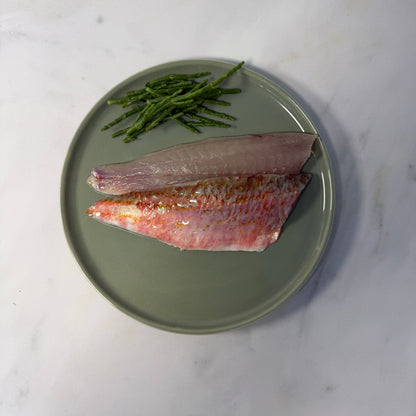 Fresh Wild Red Mullet Fillets on a slate background, from Hamiltons Fish