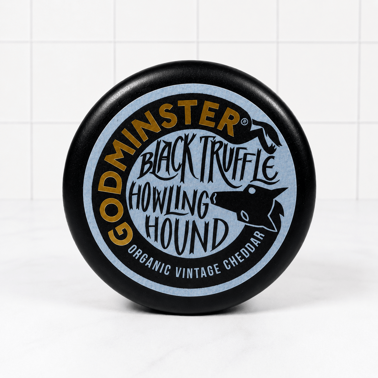 Godminster Black Truffle Howling Hound Cheddar (200g) on a slate background, from Hamiltons Fish