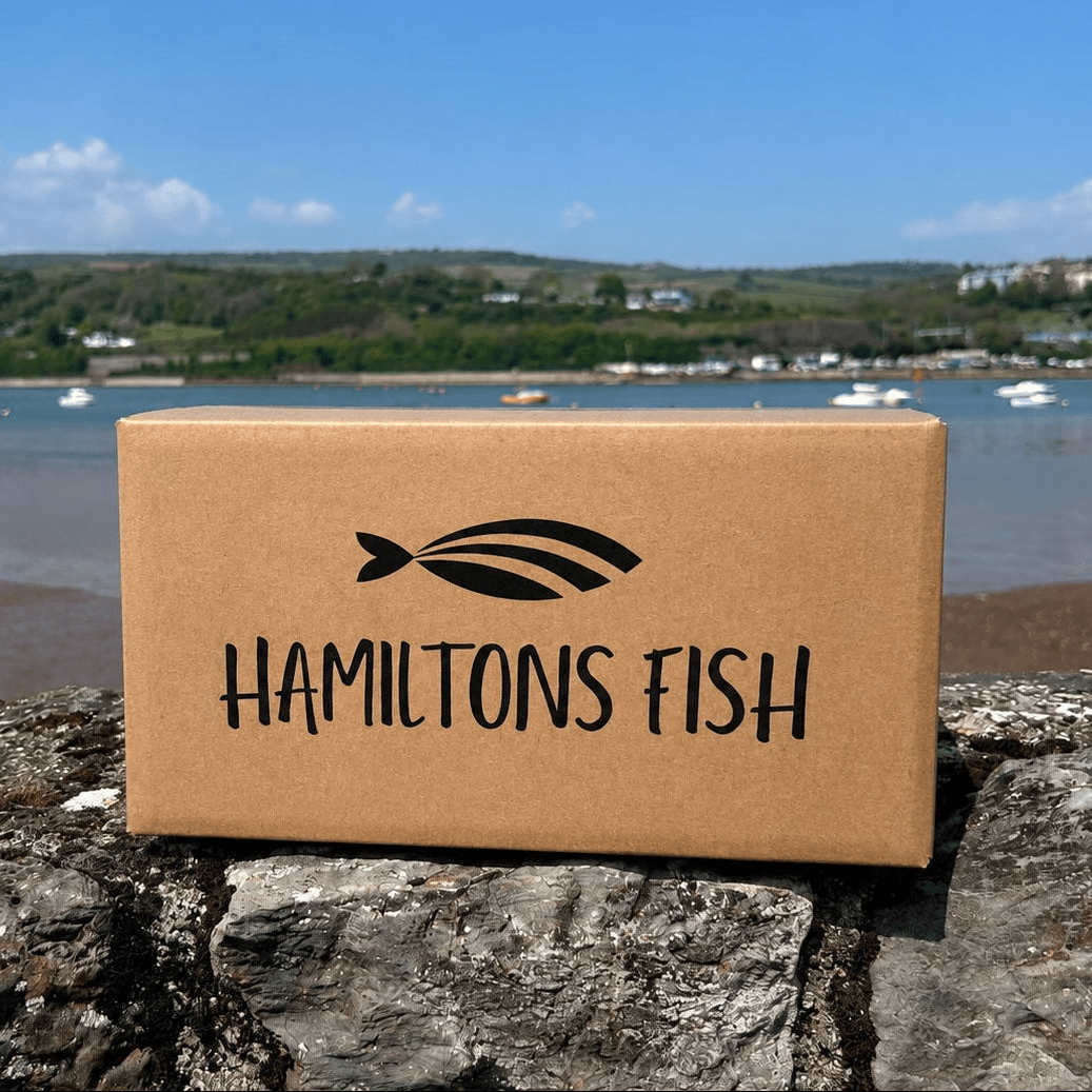 Godminster Black Truffle Howling Hound Cheddar (200g) on a slate background, from Hamiltons Fish