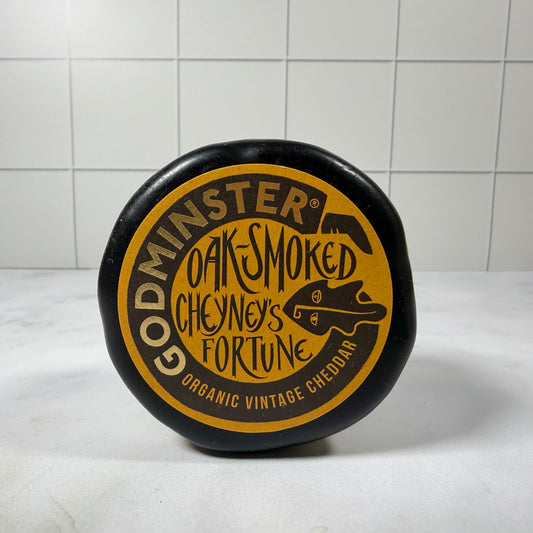 Godminster Cheyney’s Fortune Oak - Smoked Cheddar (200g) on a slate background, from Hamiltons Fish
