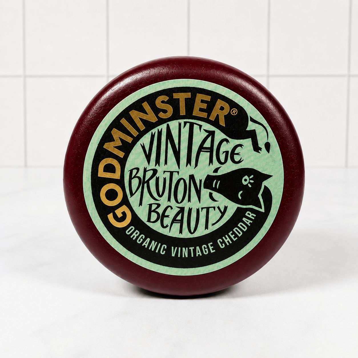 Godminster Vintage Bruton Beauty Cheddar (200g) on a slate background, from Hamiltons Fish