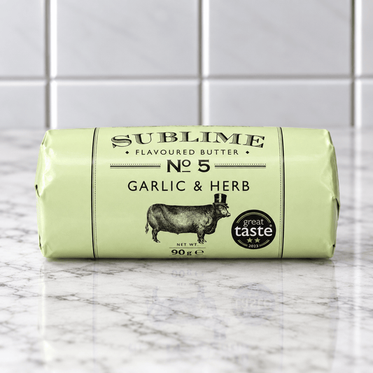 Sublime No. 5 Garlic and Herb Butter (90g) on a slate background, from Hamiltons Fish