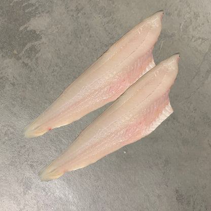 Wild Pollack Fillets on a slate background, from Hamiltons Fish