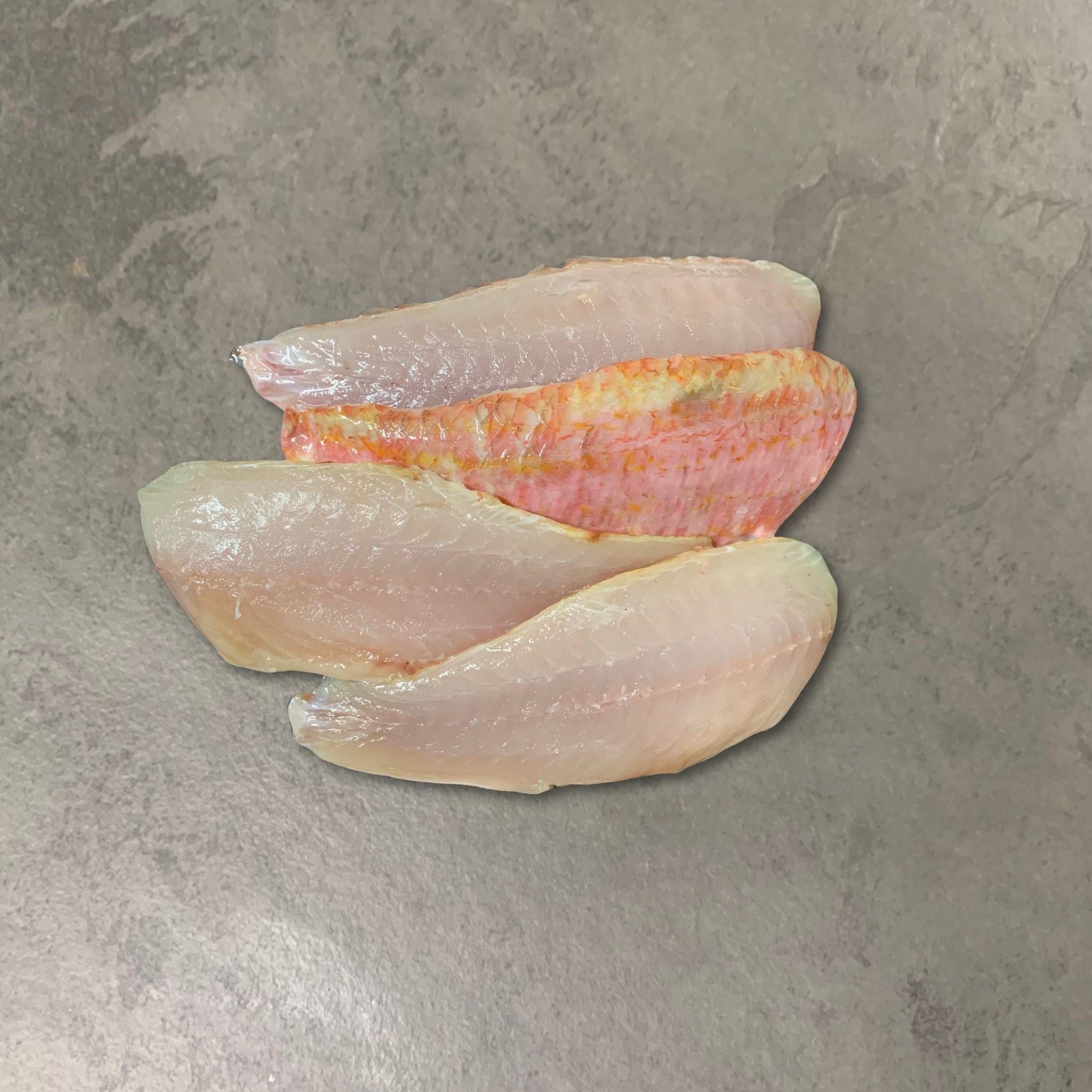 Wild Red Mullet Fillets on a slate background, from Hamiltons Fish